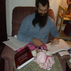 Daddy studying with New Baby Boy